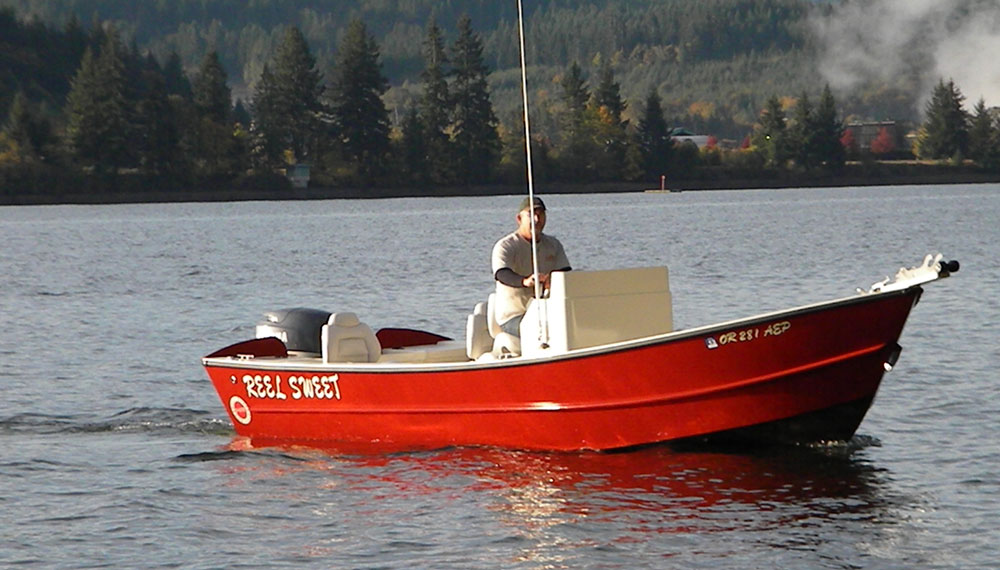Red 21 foot widebody Tolman Skiff